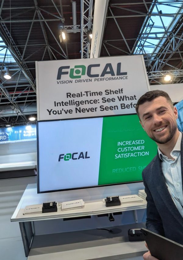 Focal Employee in front of display